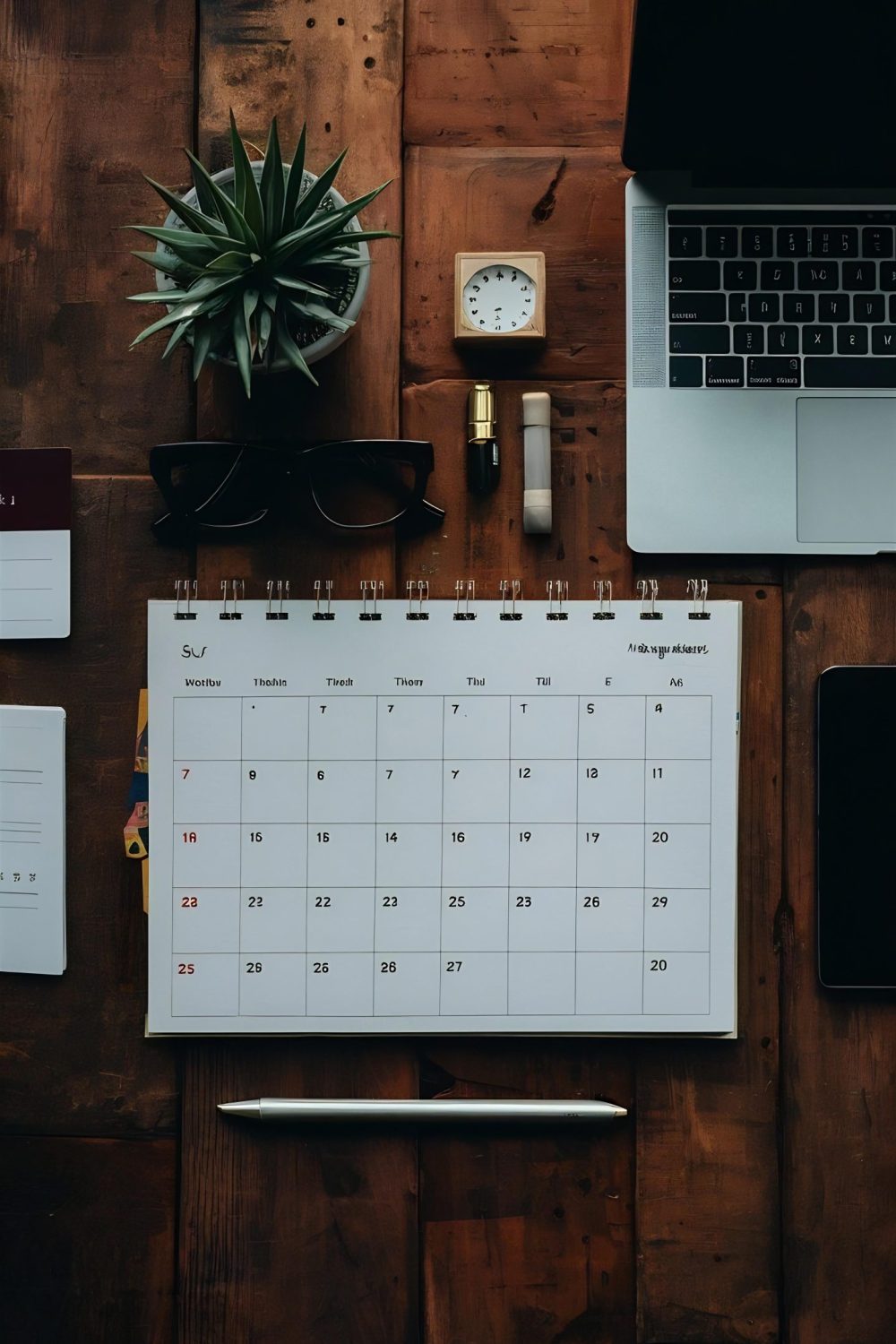 flat-lay-calendar-laptop-arrangement